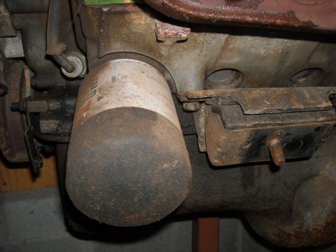 1979 Ford F-150 - Close-up view of an engine oil filter and a motor mount.