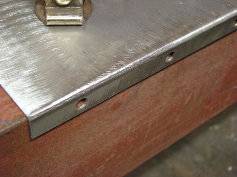 1948 Jeep Wrangler - Close-up of a metal part with visible holes and a clamp, with text from Supermotors.net at the bottom.