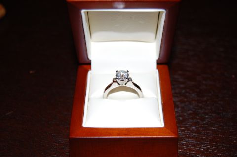 2002 BMW M3 - Diamond ring in a wooden box.
