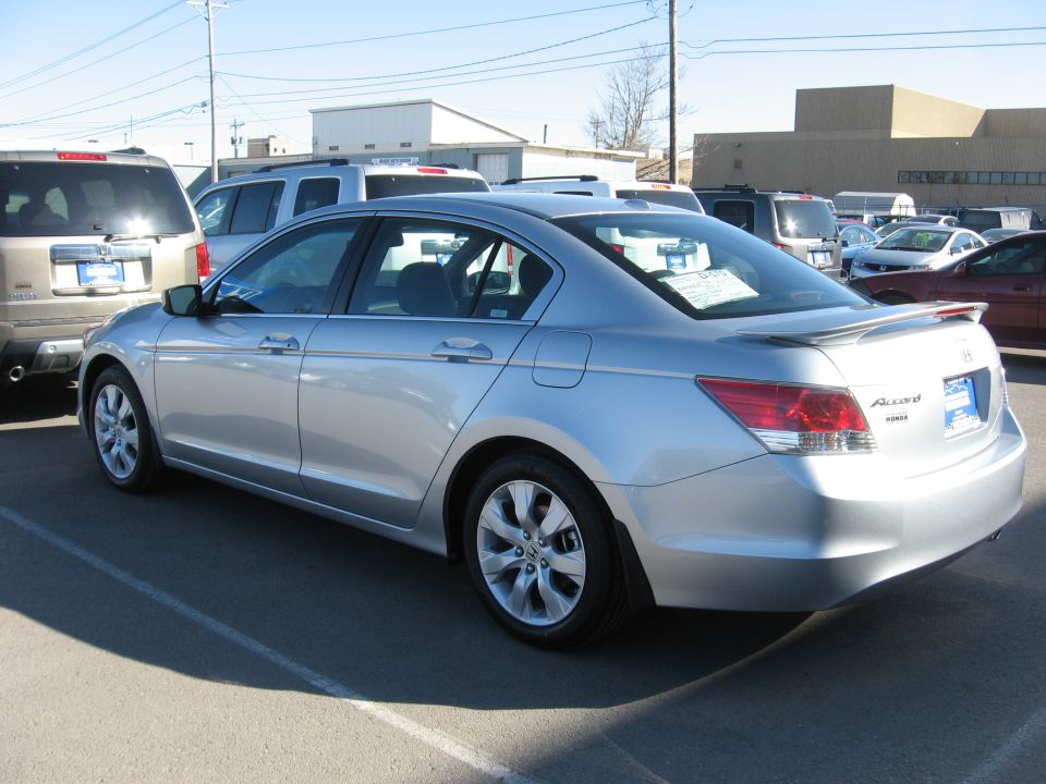 Silver 2009 Honda Accord sedan, rear 3/4 view. Accord badge visible
