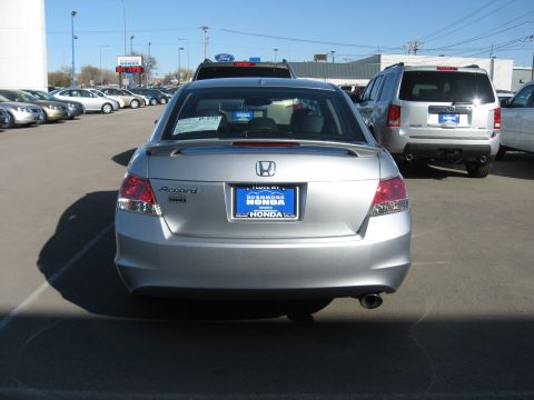 2009 Honda Accord - Rear view of a silver Honda Accord sedan, parked in a lot with other vehicles.