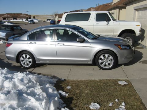 2009 Honda Accord - Silver sedan parked on a driveway with snow on the ground, next to a white SUV.