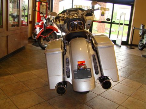 2009 Harley-Davidson FLH - Rear view of a silver 2009 Harley-Davidson FLH motorcycle parked indoors.