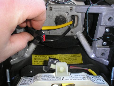 1995 Ford Bronco - Disconnecting the airbag electrical connector from the steering wheel assembly.
