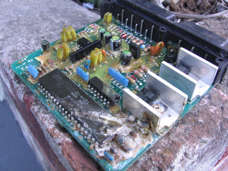 Corroded circuit board with large chip and heatsinks