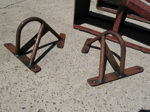 1986 Ford Bronco - These metal brackets appear to be custom fabricated parts, not rear shocks for a 1986 Ford Bronco.