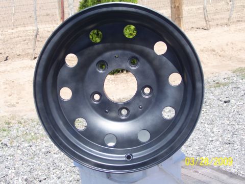 1993 Ford Bronco - A single dark gray wheel is shown close-up, with a watermark in the corner.