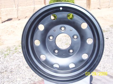1993 Ford Bronco - A single black painted wheel is shown, likely after being refurbished or customized.