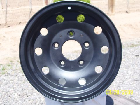 1993 Ford Bronco - A black steel wheel is shown, likely for a truck or SUV.