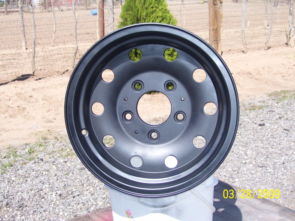 black wheel, looks like it's been painted