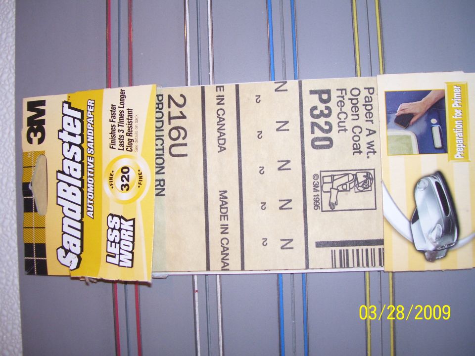 3M SandBlaster automotive sandpaper and a chrome car mirror