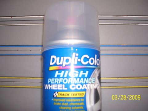 1993 Ford Bronco - A can of Dupli-Color wheel coating is shown against a gray background with horizontal lines.
