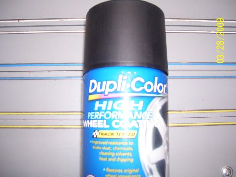 1993 Ford Bronco - A can of Dupli-Color High Performance Wheel Coating is shown against a grey background with horizontal lines.
