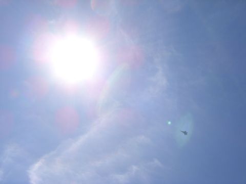 1978 Ford Bronco - Jet airplane in flight against a bright sky, with a website logo in the corner.