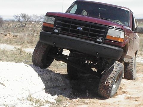 1992 Ford Bronco - This 1992 Ford Bronco is navigating a rocky, uneven terrain.