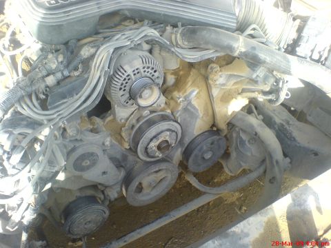 1992 Ford Crown Victoria - Close-up view of engine pulleys and alternator, likely from a Ford vehicle.
