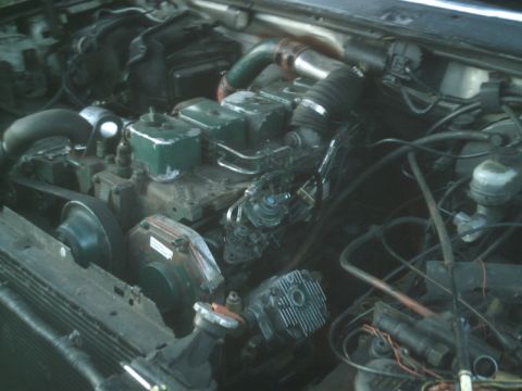 1989 Ford Bronco - Close-up view of a diesel engine, showing various mechanical parts and connections.