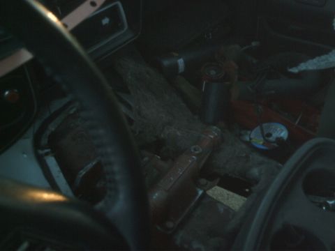 1989 Ford Bronco - The interior of this vehicle is filled with tools, debris, and a CD, making identification difficult.