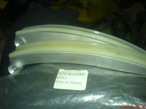 1992 Ford Crown Victoria - These are timing chain guides, likely for an engine. The part number is visible on the label.