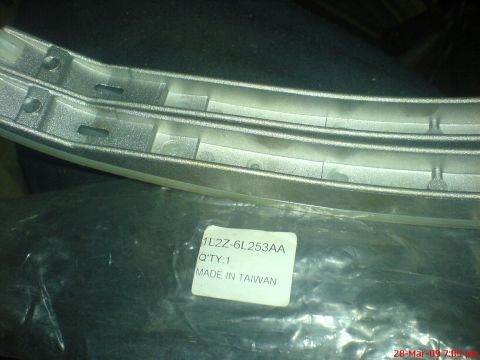 1992 Ford Crown Victoria - A chrome trim piece is shown, identified by part number 1L2Z-6L253AA and labeled as made in Taiwan.