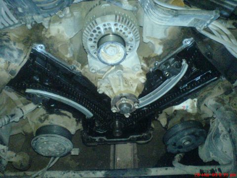 1992 Ford Crown Victoria - Close-up view of an engine's timing chain and related components during maintenance.