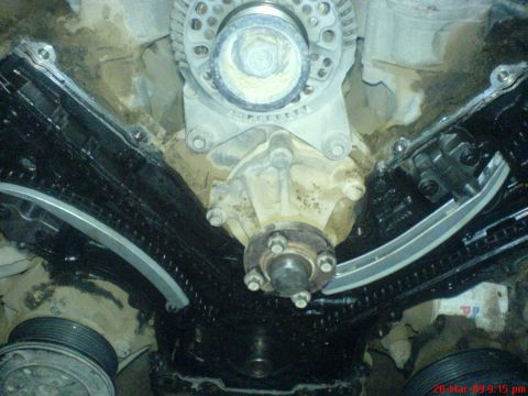 1992 Ford Crown Victoria - Close-up view of engine timing chains and related components during repair.