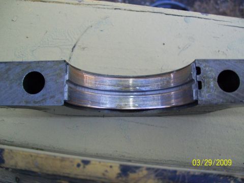 1973 Mercury Cougar - Close-up of an engine bearing, indicating wear on its internal surfaces.
