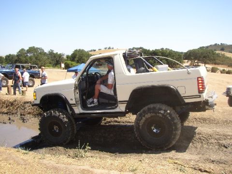 1989 Ford Bronco - This modified SUV appears to be from the 1980s, not a 1989 model as claimed.
