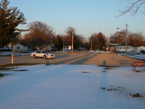 1997 Mercury Grand Marquis - A white 1997 Mercury Grand Marquis is seen driving on a street during winter.