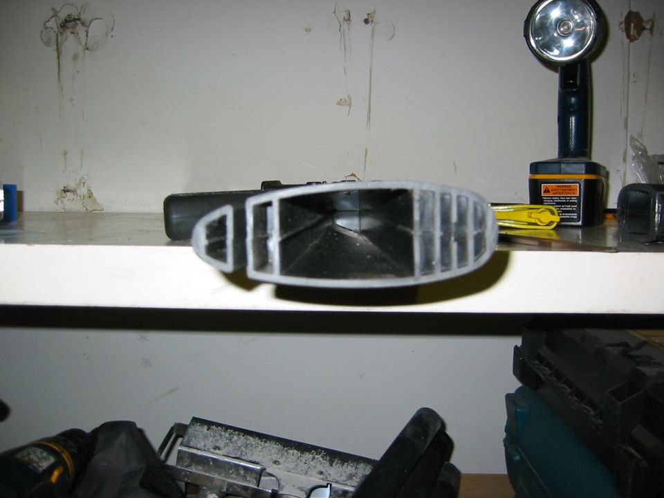 Interior vent part, gray and black plastic