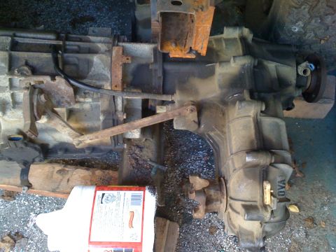 1990 Ford Bronco - Close-up of a transmission and transfer case assembly, with 'TOYO' visible on the casing.