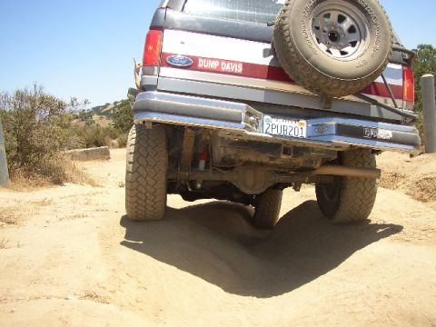 1989 Ford Bronco - Rear view of a 1989 Ford Bronco, showing its spare tire and license plate.