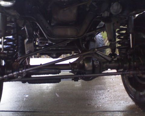 1996 Ford Bronco - Close-up view of the undercarriage, showing suspension and drivetrain components.
