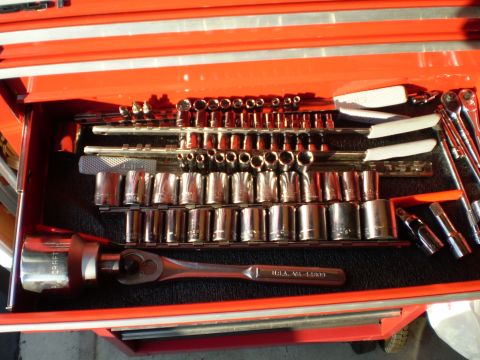 1981 Garelli Rally Sport - A collection of socket wrenches and extensions neatly organized within a red toolbox drawer.