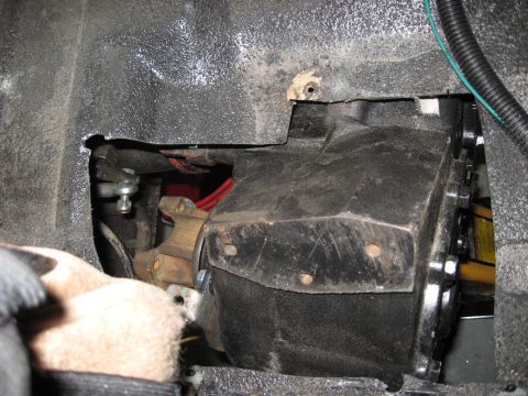 1991 Ford Bronco - Detail of a vehicle's transmission components, showing mechanical linkages and housing.