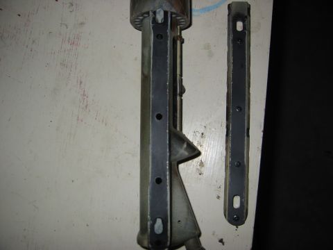 1996 Ford Bronco - Two metal brackets with screw holes are shown side-by-side.