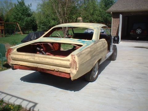 1967 Mercury Cyclone - This 1967 Mercury Cyclone is undergoing restoration, with its bodywork in primer and doors ajar.