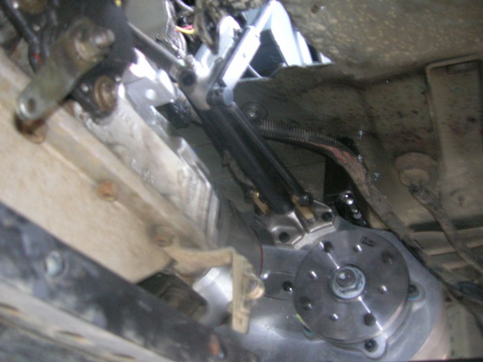 Undercarriage view of vehicle transmission and linkage system