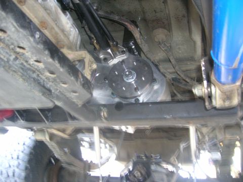 1996 Ford Bronco - Close-up view of the undercarriage, focusing on the transfer case and suspension system.