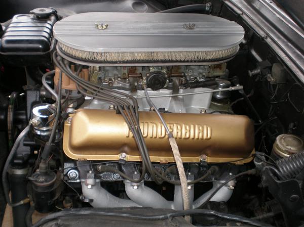 Ford V8 engine with gold 'THUNDERBIRD' valve cover and oval air cleaner