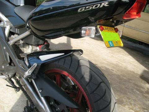 2008 Kawasaki Ninja R - Close-up of a black motorcycle's rear tire and fender, with an Oregon license plate visible.