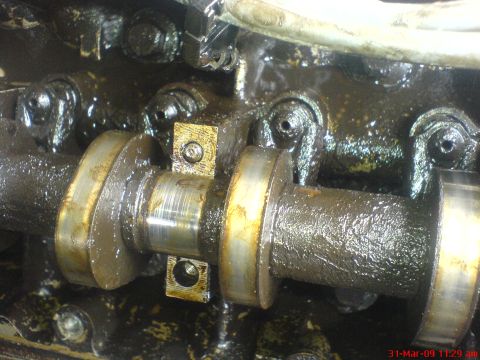 1992 Ford Crown Victoria - Engine internal component detail, likely a camshaft and its associated parts within a cylinder head.