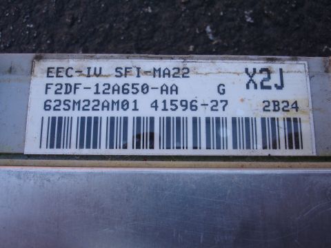 1993 Ford Taurus - This engine control module has the part number F2DF-12A650-AA and a barcode visible on its label.