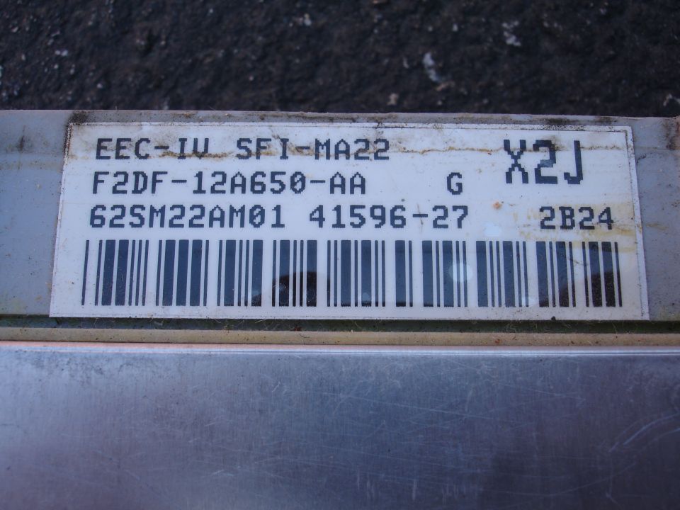 Engine control module with label F2DF-12A650-AA and barcode