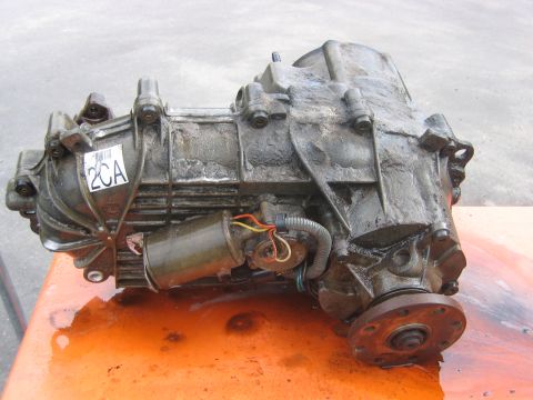 1992 Ford Bronco - A used transfer case, likely for a 4x4 vehicle, is shown with a label and wiring.