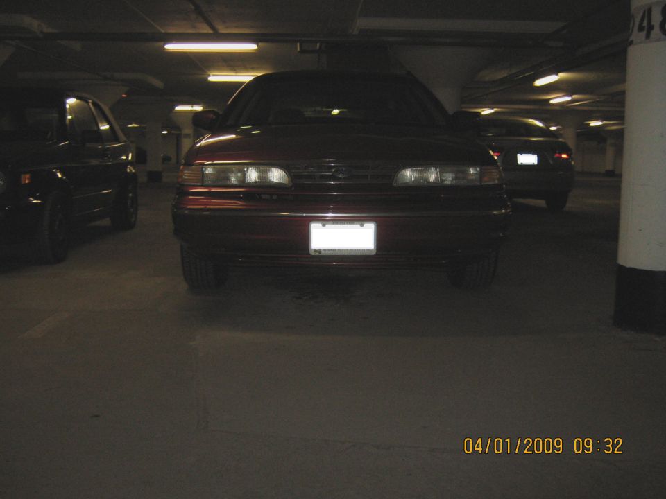 1997 Ford Crown Victoria front view in parking garage, another car to the left
