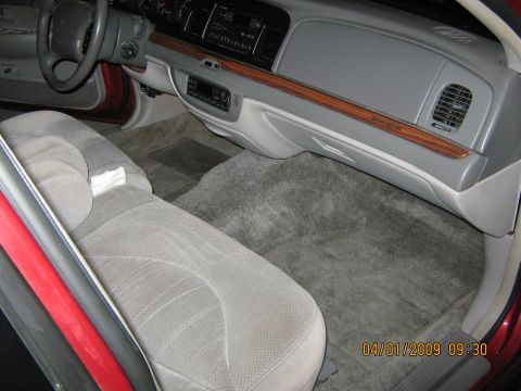 1997 Ford Crown Victoria - Interior view of a 1997 Ford Crown Victoria, showing the dashboard, seats, and carpeting.