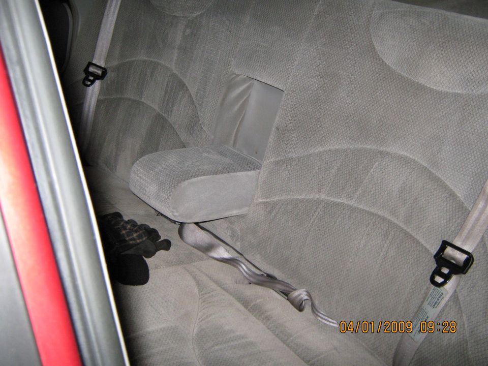 Gray rear seats and seatbelts in a 1997 Ford Crown Victoria