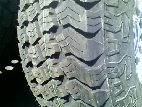 1996 Ford Bronco - This photo shows the aggressive tread pattern of an off-road tire, not a specific vehicle model year.