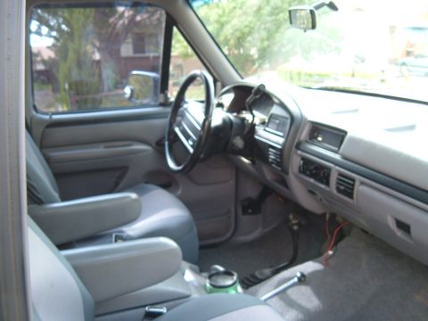 1994 Ford Bronco - Interior view of a 1994 Ford Bronco, gray seats and dashboard.